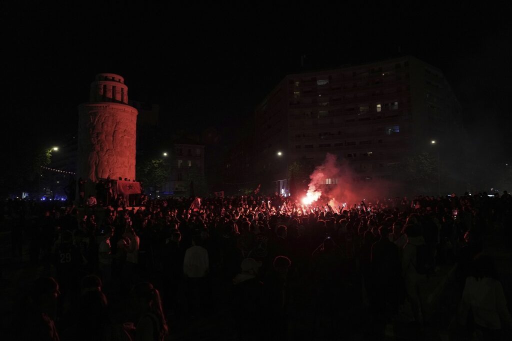 PSG fans celebrate after the Champions League semifinal, second leg soccer match between Paris Saint-Germain and Arsenal at the Parc des Princes in Paris, Wednesday, May 7, 2025. (AP Photo/Aurelien Morissard)