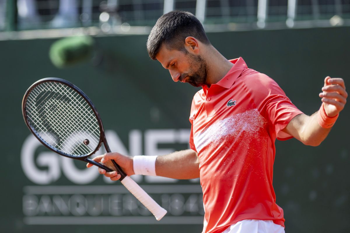 Novak Djokovic, of Serbia, reacts after losing a point to Cameron Norrie of Britain, during their semi-final match, at the ATP 250 Geneva Open tournament in Geneva, Switzerland, Friday, May 23, 2025. (Martial Trezzini/Keystone via AP)