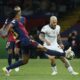 Barcelona's Jules Kounde, left, fights for the ball with Inter Milan's Federico Dimarco during the Champions League semifinal first leg soccer match between Barcelona and Inter Milan at the Lluis Companys Olympic Stadium in Barcelona, Spain, Wednesday, April 30, 2025. (AP Photo/Joan Monfort)