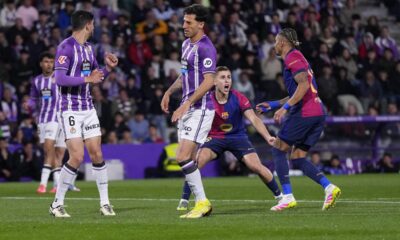 Barcelona's Raphinha, right, celebrates after scoring his side's first goal during the Spanish La Liga soccer match between Valladolid and FC Barcelona at the Jose Zorrilla stadium in Valladolid, Spain, Saturday, May 3, 2025. (AP Photo/Manu Fernandez)