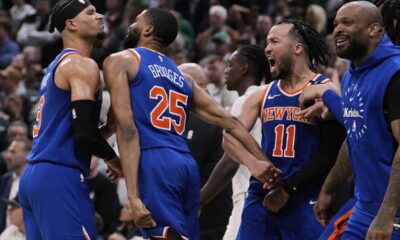 New York Knicks celebrate after defeating the Boston Celtics in Game 1 of an NBA basketball second-round playoff series Monday, May 5, 2025, in Boston. (AP Photo/Charles Krupa)