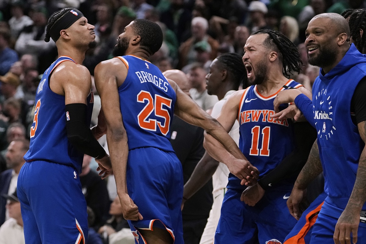 New York Knicks celebrate after defeating the Boston Celtics in Game 1 of an NBA basketball second-round playoff series Monday, May 5, 2025, in Boston. (AP Photo/Charles Krupa)