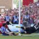 Nottingham Forest's Taiwo Awoniyi, left, and Leicester City's Facundo Buonanotte collide with the goal post during a Premier League soccer match at City Ground in Nottingham, England, Sunday May 11, 2025. (Jacob King/PA via AP)