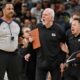 FILE - San Antonio Spurs head coach Gregg Popovich, second from right, yells at referee Bennie Adams, left, while being restrained by Spurs assistant coaches Mitch Johnson, right, and Becky Hammon during the first half of an NBA basketball game against the New Orleans Pelicans on Friday, March 18, 2022, in San Antonio. (AP Photo/Darren Abate, File)