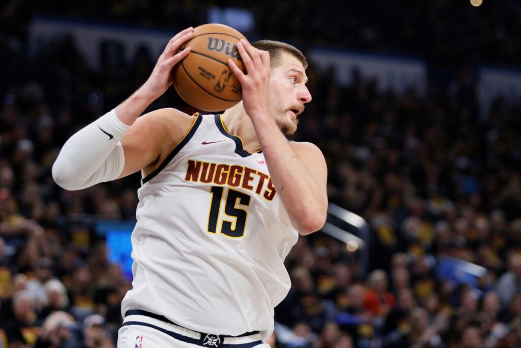 Denver Nuggets' Nikola Jokic (15) grabs a rebound in the second half of Game 1 of an NBA basketball second-round playoff series against the Oklahoma City Thunder Monday, May 5, 2025, in Oklahoma City. (AP Photo/Nate Billings)