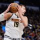 Denver Nuggets' Nikola Jokic (15) grabs a rebound in the second half of Game 1 of an NBA basketball second-round playoff series against the Oklahoma City Thunder Monday, May 5, 2025, in Oklahoma City. (AP Photo/Nate Billings)