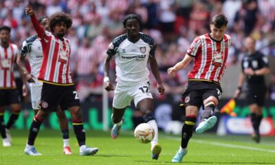 Sheffield United's Anel Ahmedhodzic (right) and Sunderland's Eliezer Mayenda battle for the ball during the Sky Bet Championship play off final between Sheffield United and Sunderland, at Wembley Stadium, London, Saturday May 24, 2025. (Ben Whitley/PA via AP)