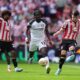 Sheffield United's Anel Ahmedhodzic (right) and Sunderland's Eliezer Mayenda battle for the ball during the Sky Bet Championship play off final between Sheffield United and Sunderland, at Wembley Stadium, London, Saturday May 24, 2025. (Ben Whitley/PA via AP)