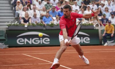 Serbia's Novak Djokovic returns the ball to France's Corentin Moutet during their second round match of the French Tennis Open, at the Roland-Garros stadium, in Paris, Thursday, May 29, 2025. (AP Photo/Christophe Ena)