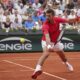 Serbia's Novak Djokovic returns the ball to France's Corentin Moutet during their second round match of the French Tennis Open, at the Roland-Garros stadium, in Paris, Thursday, May 29, 2025. (AP Photo/Christophe Ena)
