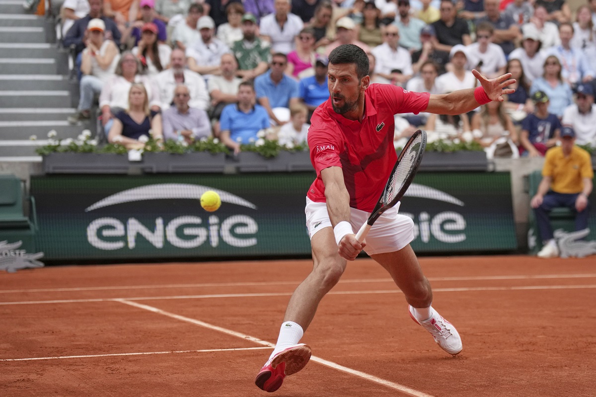Serbia's Novak Djokovic returns the ball to France's Corentin Moutet during their second round match of the French Tennis Open, at the Roland-Garros stadium, in Paris, Thursday, May 29, 2025. (AP Photo/Christophe Ena)