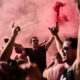 Manchester United fans cheer while gathering in downtown Bilbao, Spain, ahead of the UEFA Europa League final soccer match between Manchester United and Tottenham Hotspur, Tuesday, May 20, 2025. (AP Photo/Bernat Armangue)