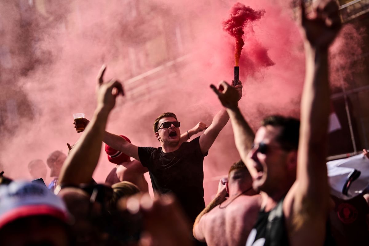 Manchester United fans cheer while gathering in downtown Bilbao, Spain, ahead of the UEFA Europa League final soccer match between Manchester United and Tottenham Hotspur, Tuesday, May 20, 2025. (AP Photo/Bernat Armangue)