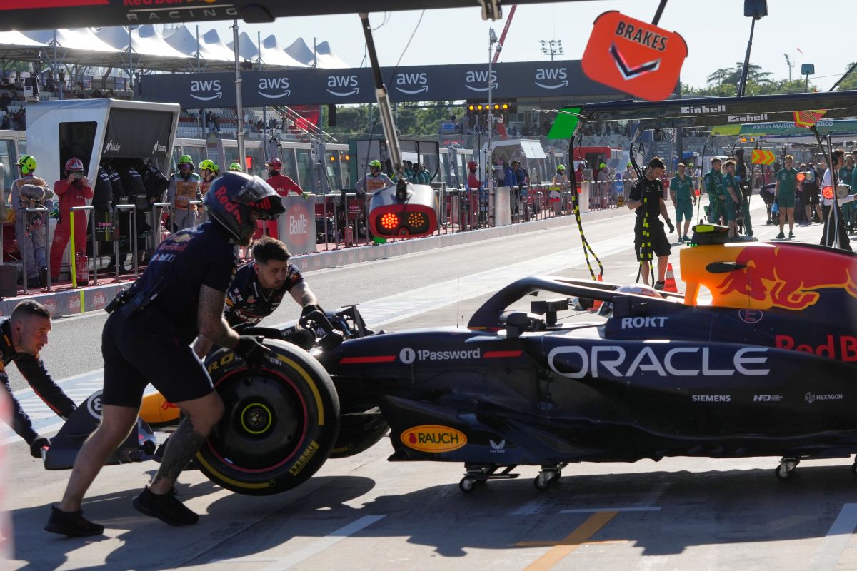 Red Bull driver Yuki Tsunoda of Japan gets pushed back into his garage during the second free practice at the Enzo and Dino Ferrari racetrack, ahead the Italy's Emilia Romagna Formula One Grand Prix, in Imola, Italy, Friday, May 16, 2025. (AP Photo/Luca Bruno)