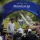 People take pictures with the trophy during the opening of the official UEFA fan festival in Munich, Germany, Thursday, May 29, 2025, ahead of the Champions League final soccer match between Inter and PSG. (AP Photo/Matthias Schrader)
