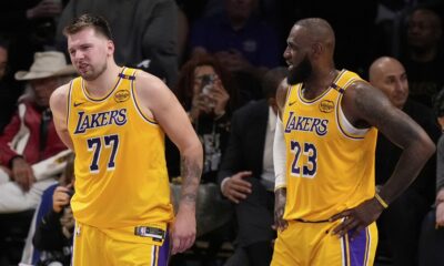 Los Angeles Lakers guard Luka Doncic (77) walks off the court after an injury during the first half in Game 5 of an NBA basketball first-round playoff series against the Minnesota Timberwolves, Wednesday, April 30, 2025, in Los Angeles. (AP Photo/Mark J. Terrill)