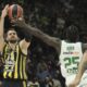 Fenerbahce's Marko Guduric shoots over Panathinaikos's Kendrick Nunn duirng the Euroleague seimifinal basketball match between Fenerbahce and Panathinaikos in Abu Dhabi, United Arab Emirates, Sunday, May 18, 2025. (AP Photo/Fatima Shbair)