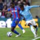 Crystal Palace's Tyrick Mitchell, left, and Nottingham Forest's Anthony Elanga battle for the ball during the English Premier League soccer match between Crystal Palace and Nottingham Forest at Selhurst Park, London, Monday, May 5, 2025. (Bradley Collyer/PA via AP)