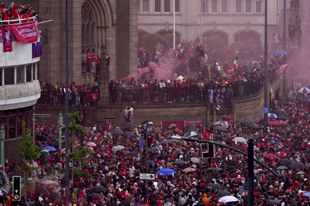 Crowds gather near Liverpool Waterfront before the Premier League winners parade in Liverpool, England, Monday, May 26, 2025. (Owen Humphreys/PA via AP)
