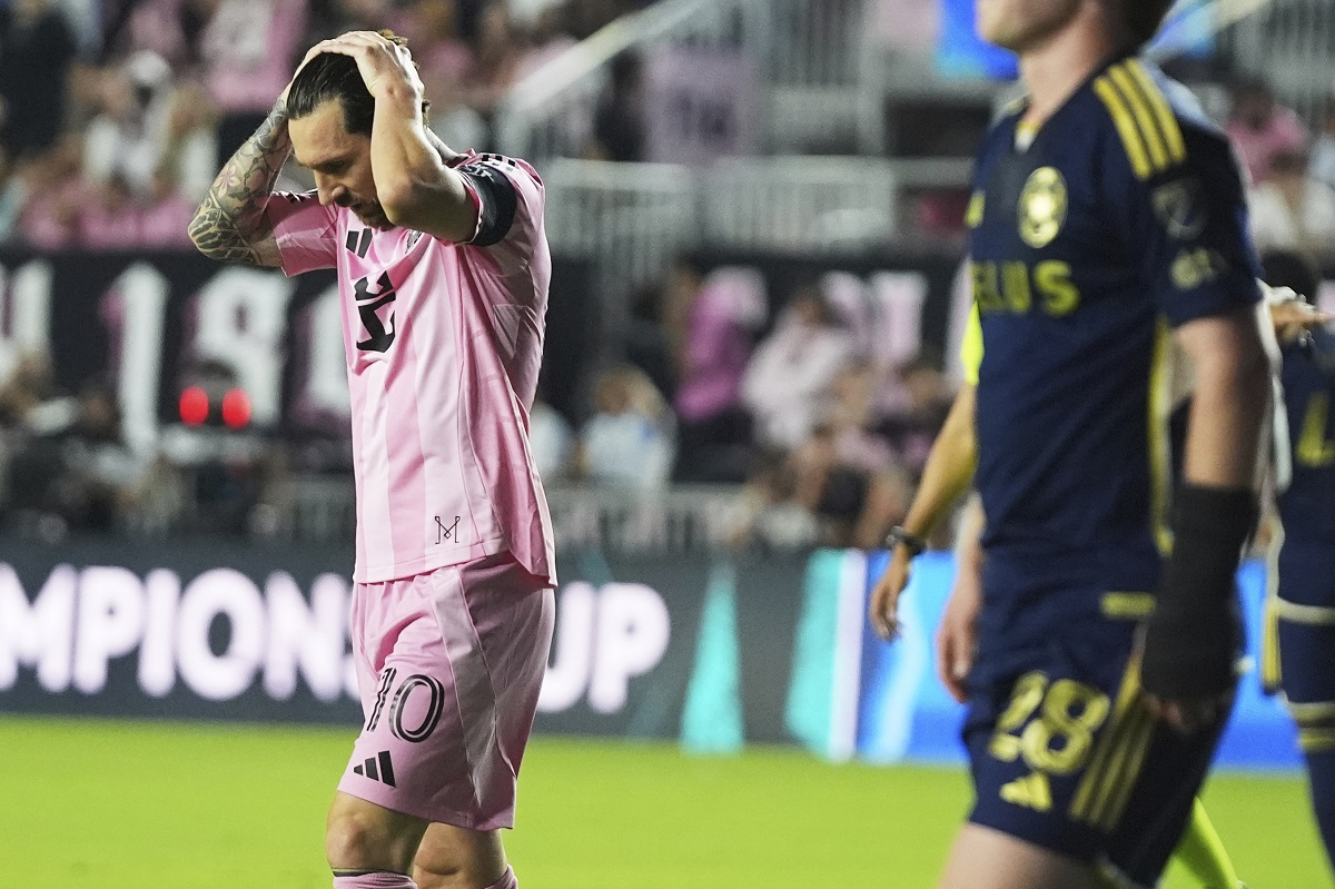 Inter Miami forward Lionel Messi (10) reacts after missing shot on the goal during the first half of a CONCACAF Champions Cup second-leg semifinal soccer match against the Vancouver Whitecaps, Wednesday, April 30, 2025, in Fort Lauderdale, Fla. (AP Photo/Lynne Sladky)