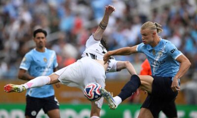 Manchester City's Erling Haaland, right, and Juventus' Nicolo Savona battle for the ball during the Club World Cup Group G soccer match between Juventus and Manchester City in Orlando, Fla., Thursday, June 26, 2025. (AP Photo/Phelan Ebenhack)