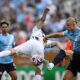 Manchester City's Erling Haaland, right, and Juventus' Nicolo Savona battle for the ball during the Club World Cup Group G soccer match between Juventus and Manchester City in Orlando, Fla., Thursday, June 26, 2025. (AP Photo/Phelan Ebenhack)