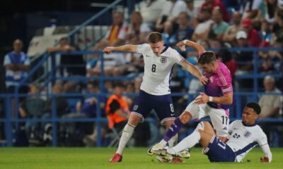 Germany's Jan Thielmann, center, duels for the ball with England's Elliot Anderson, left, and England's Ethan Nwaneri during the group B European U-20 Championship soccer match between England and Germany at Nitra Stadium in Nitra, Slovakia, Wednesday, June 18, 2025. (AP Photo/Petr David Josek)