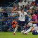 Germany's Jan Thielmann, center, duels for the ball with England's Elliot Anderson, left, and England's Ethan Nwaneri during the group B European U-20 Championship soccer match between England and Germany at Nitra Stadium in Nitra, Slovakia, Wednesday, June 18, 2025. (AP Photo/Petr David Josek)