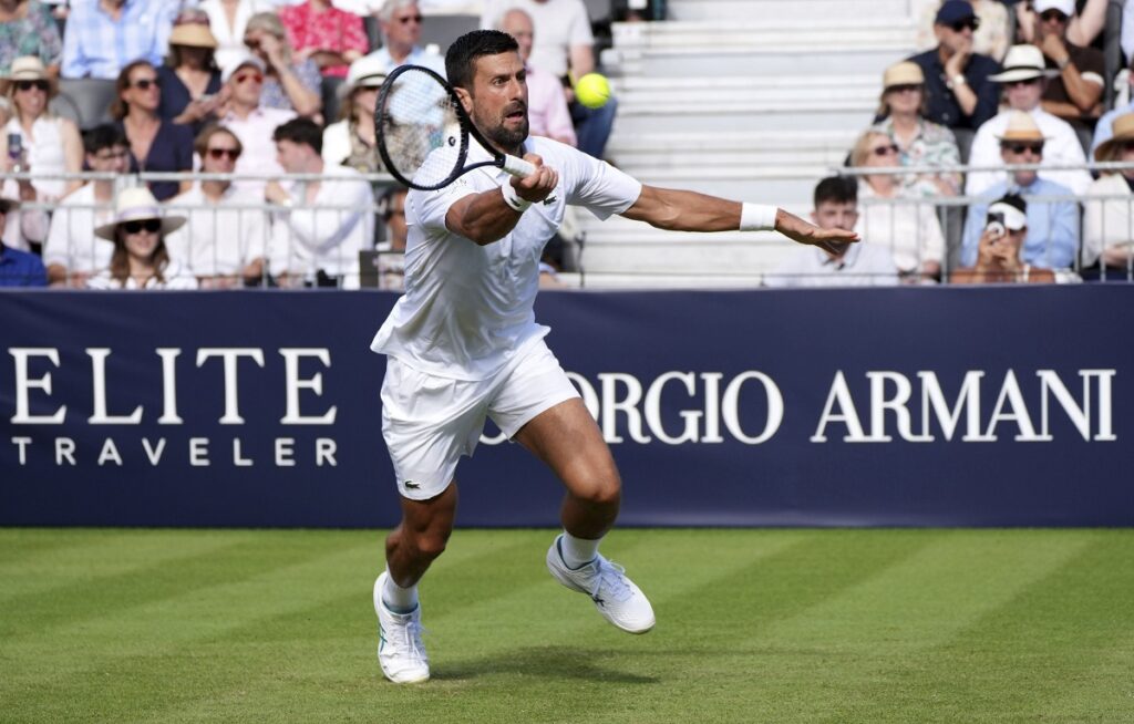 Novak Djokovic hits a volley against Karen Khachanov during the Giorgio Armani Tennis Classic at The Hurlingham Club, Friday, June 27, 2025, in London. (Jonathan Brady/PA via AP)