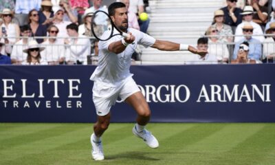 Novak Djokovic hits a volley against Karen Khachanov during the Giorgio Armani Tennis Classic at The Hurlingham Club, Friday, June 27, 2025, in London. (Jonathan Brady/PA via AP)