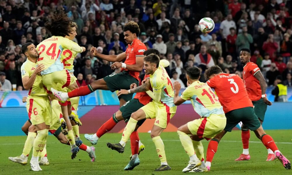 Spain's Marc Cucurella (24) heads the ball during the Nations League final soccer match between Portugal and Spain at the Allianz Arena in Munich, Germany, Sunday, June 8, 2025. (AP Photo/Martin Meissner)