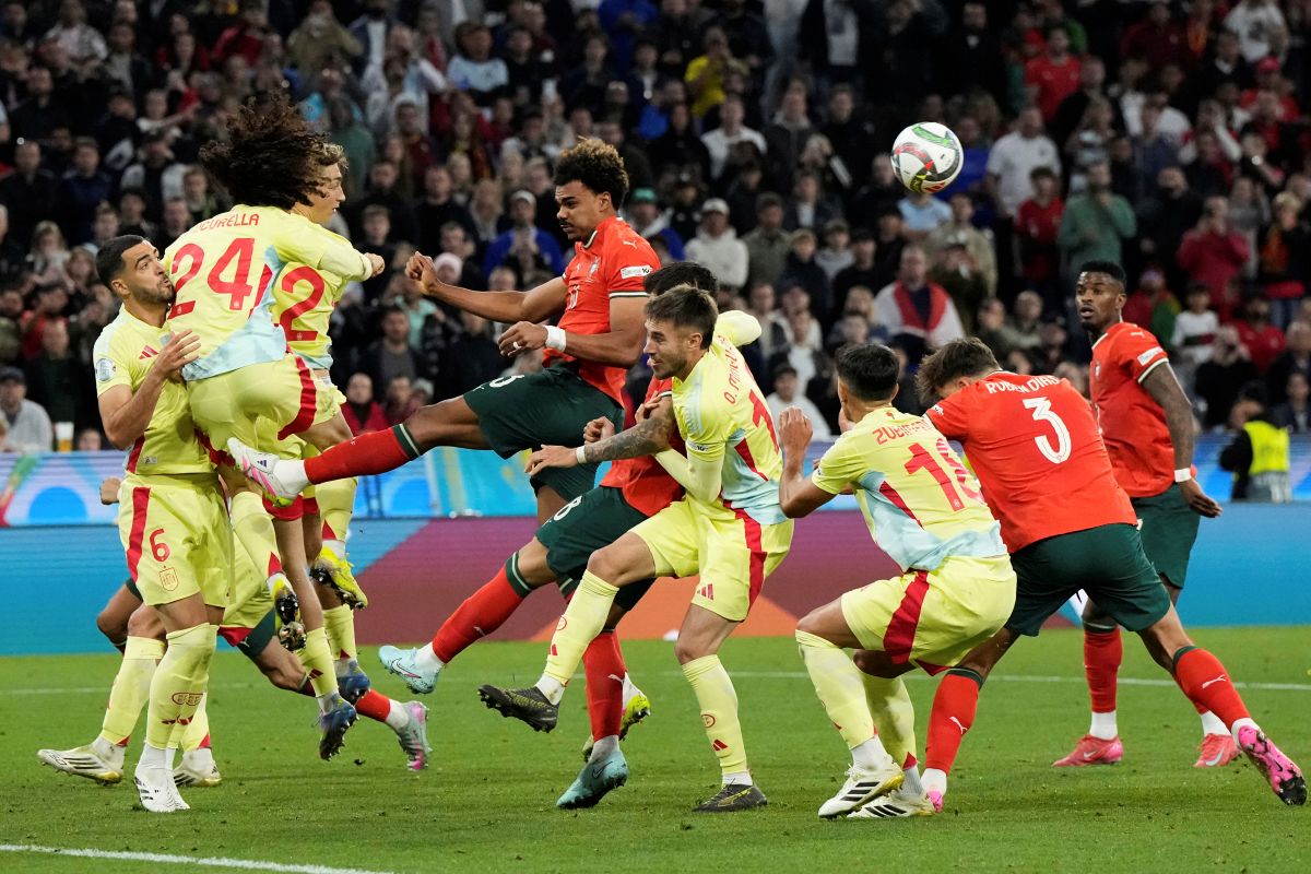 Spain's Marc Cucurella (24) heads the ball during the Nations League final soccer match between Portugal and Spain at the Allianz Arena in Munich, Germany, Sunday, June 8, 2025. (AP Photo/Martin Meissner)