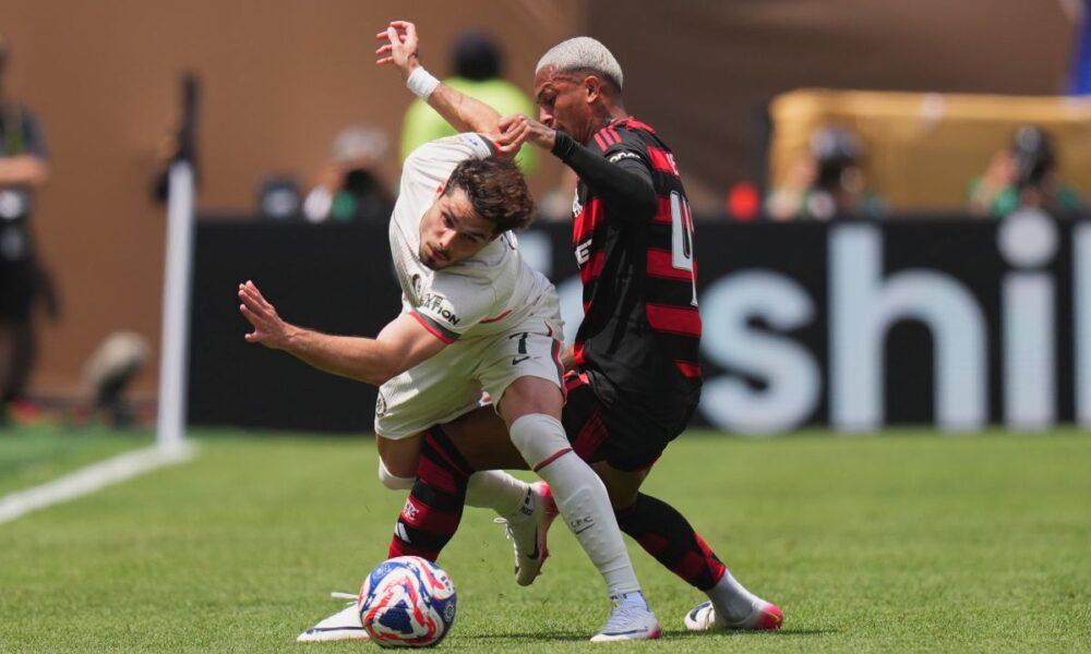 Chelsea's Pedro Neto, left, and Flamengo's Wesley Franka fight for the ball during the Club World Cup Group D soccer match between Flamengo and Chelsea in Philadelphia, Friday, June 20, 2025. (AP Photo/Chris Szagola)