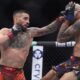 Ilia Topuria, left, fights Charles Oliveira in a lightweight title fight at UFC 317, Saturday, June 28, 2025, in Las Vegas. (AP Photo/John Locher)