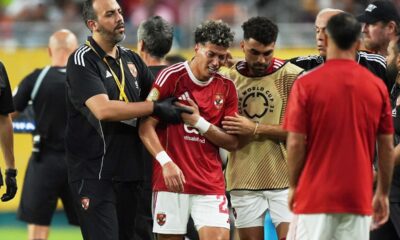 Al Ahly's Emam Ashour, center, leaves the pitch after injuring during the Club World Cup group A soccer match between Al Ahly and Inter Miami in Miami, Fla., Saturday, June 14, 2025. (AP Photo/Rebecca Blackwell)