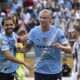 Manchester City's Erling Haaland, right, celebrates with teammate Bernardo Silva after scoring his side's third goal during the Club World Cup Group G soccer match between Juventus and Manchester City in Orlando, Fla., Thursday, June 26, 2025. (AP Photo/Phelan Ebenhack)