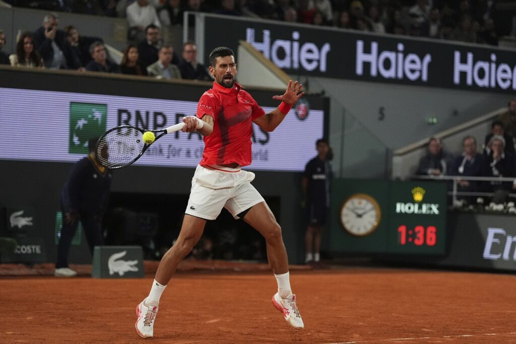 Serbia's Novak Djokovic plays a shot against Germany's Alexander Zverev during their quarterfinal match of the French Tennis Open at the Roland-Garros stadium in Paris, Wednesday, June 4, 2025. (AP Photo/Lindsey Wasson)