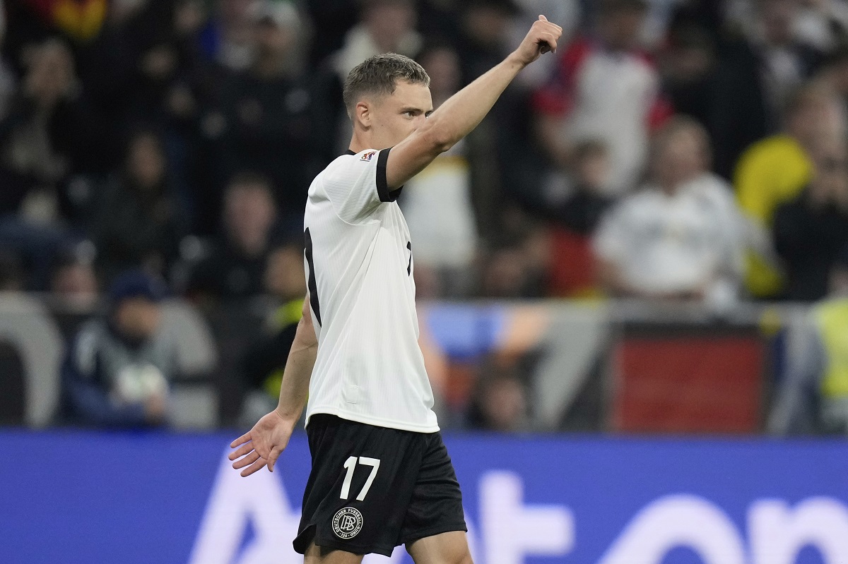 Germany's Florian Wirtz celebrates afater scoring his side's first goal during the Nations League semifinal soccer match between Portugal and Germany at the Munich Football Arena, in Munich, Germany, Wednesday, June 4, 2025. (AP Photo/Matthias Schrader)