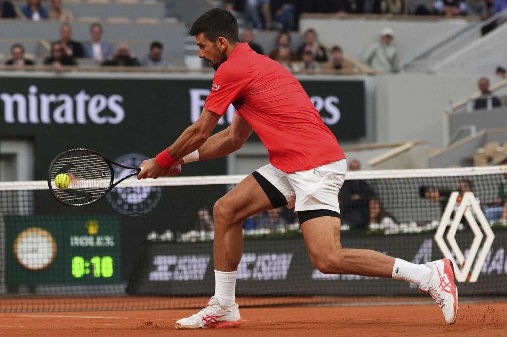Serbia's Novak Djokovic plays a shot against Germany's Alexander Zverev during their quarterfinal match of the French Tennis Open at the Roland-Garros stadium in Paris, Wednesday, June 4, 2025. (AP Photo/Lindsey Wasson)