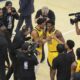 Indiana Pacers guard Bennedict Mathurin (00) and Indiana Pacers guard Tyrese Haliburton celebrate after Game 3 of the NBA Finals basketball series against the Oklahoma City Thunder, Wednesday, June 11, 2025, in Indianapolis. (AP Photo/Michael Conroy)