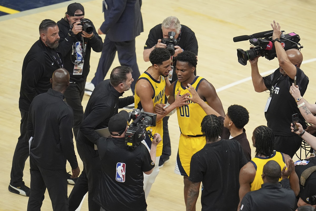 Indiana Pacers guard Bennedict Mathurin (00) and Indiana Pacers guard Tyrese Haliburton celebrate after Game 3 of the NBA Finals basketball series against the Oklahoma City Thunder, Wednesday, June 11, 2025, in Indianapolis. (AP Photo/Michael Conroy)