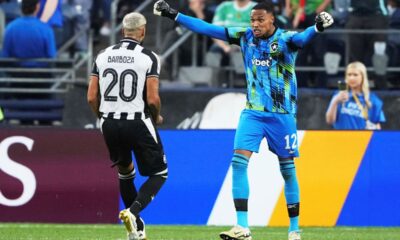 Botafogo's goalkeeper John, right, reacts with teammate Alexander Barboza during the Club World Cup group B soccer match between Botafogo and Seattle Sounders at Seattle Lumen Field, in Seattle, Sunday, June 15, 2025. (AP Photo/Lindsey Wasson)
