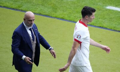 FILE - Poland's Robert Lewandowski, right, walks by Poland' head coach Michal Probierz, left, during a Group D match between Poland and Austria at the Euro 2024 soccer tournament in Berlin, Germany, Friday, June 21, 2024. (AP Photo/Petr Josek, File)