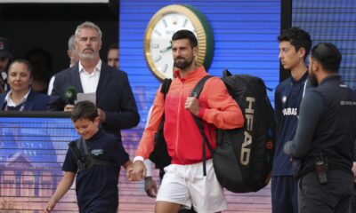 Serbia's Novak Djokovic enters the court for the quarterfinal match of the French Tennis Open against Germany's Alexander Zverev at the Roland-Garros stadium in Paris, Wednesday, June 4, 2025. (AP Photo/Aurelien Morissard)