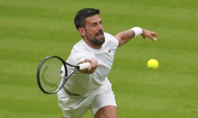Novak Djokovic of Serbia plays a return to Carlos Alcaraz of Spain during a practice session on Centre Court at the All England Lawn Tennis and Croquet Club, ahead of the Wimbledon Championships in London, Thursday, June 26, 2025. (AP Photo/Kirsty Wigglesworth)