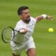 Novak Djokovic of Serbia plays a return to Carlos Alcaraz of Spain during a practice session on Centre Court at the All England Lawn Tennis and Croquet Club, ahead of the Wimbledon Championships in London, Thursday, June 26, 2025. (AP Photo/Kirsty Wigglesworth)