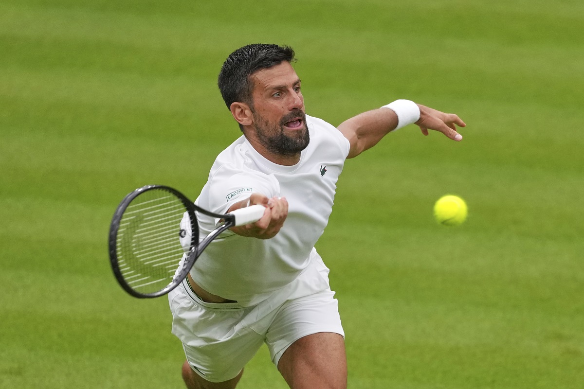 Novak Djokovic of Serbia plays a return to Carlos Alcaraz of Spain during a practice session on Centre Court at the All England Lawn Tennis and Croquet Club, ahead of the Wimbledon Championships in London, Thursday, June 26, 2025. (AP Photo/Kirsty Wigglesworth)