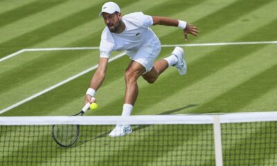 Novak Djokovic of Serbia plays a return during a practice session at the All England Lawn Tennis and Croquet Club, ahead of the Wimbledon Championships in London, Wednesday, June 25, 2025. (AP Photo/Kirsty Wigglesworth)
