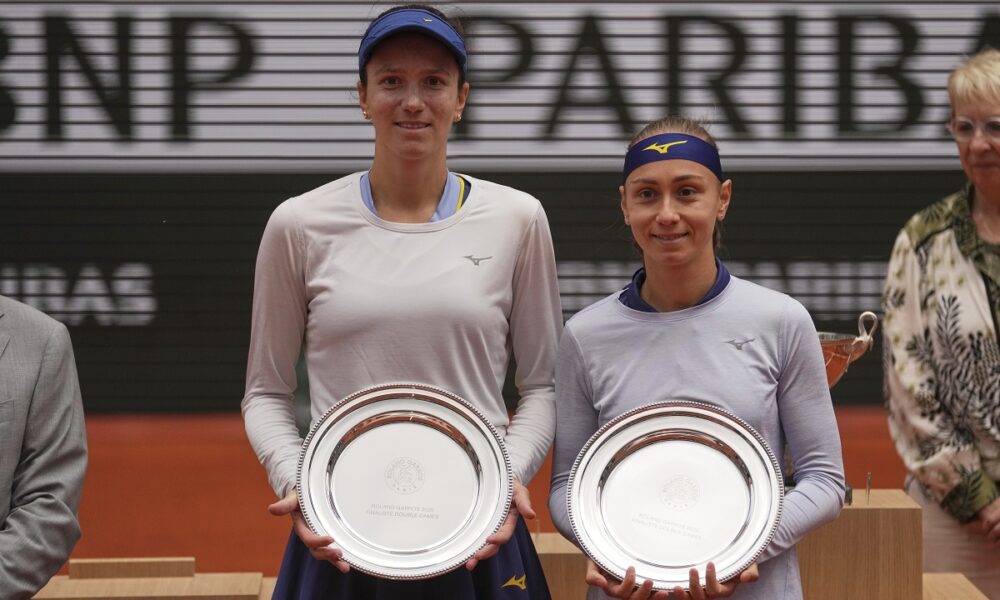 Second placed Kazakhstan Anna Danilina, left, and Serbia's Aleksandra Krunic pose with their trophies after the women's doubles final match of the French Tennis Open against winners Italy's Jasmine Paolini and Sara Errani at the Roland-Garros stadium in Paris, Sunday, June 8, 2025. (AP Photo/Thibault Camus)