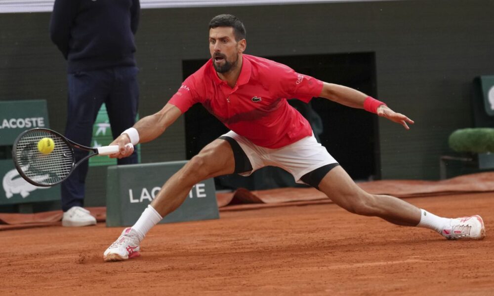 Serbia's Novak Djokovic plays a shot against Germany's Alexander Zverev during their quarterfinal match of the French Tennis Open at the Roland-Garros stadium in Paris, Wednesday, June 4, 2025. (AP Photo/Aurelien Morissard)